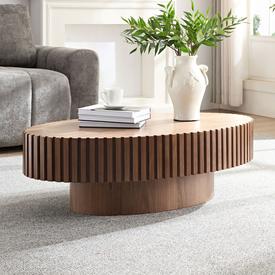 Belffin-oval-wooden-coffee-table-with-slatted-pedestal-base-and-vase-decor-in-living-room